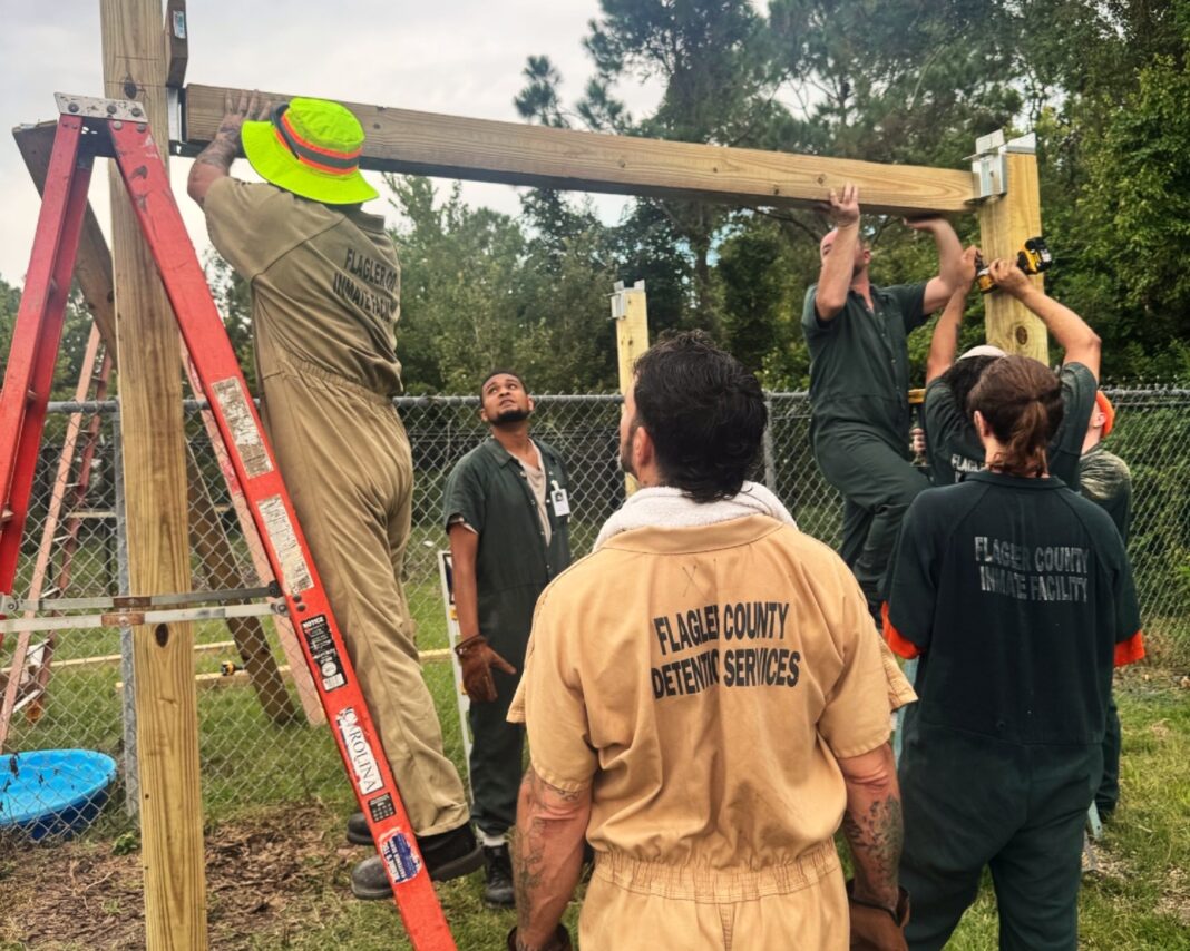 SMART Program inmates constructing dog shelters