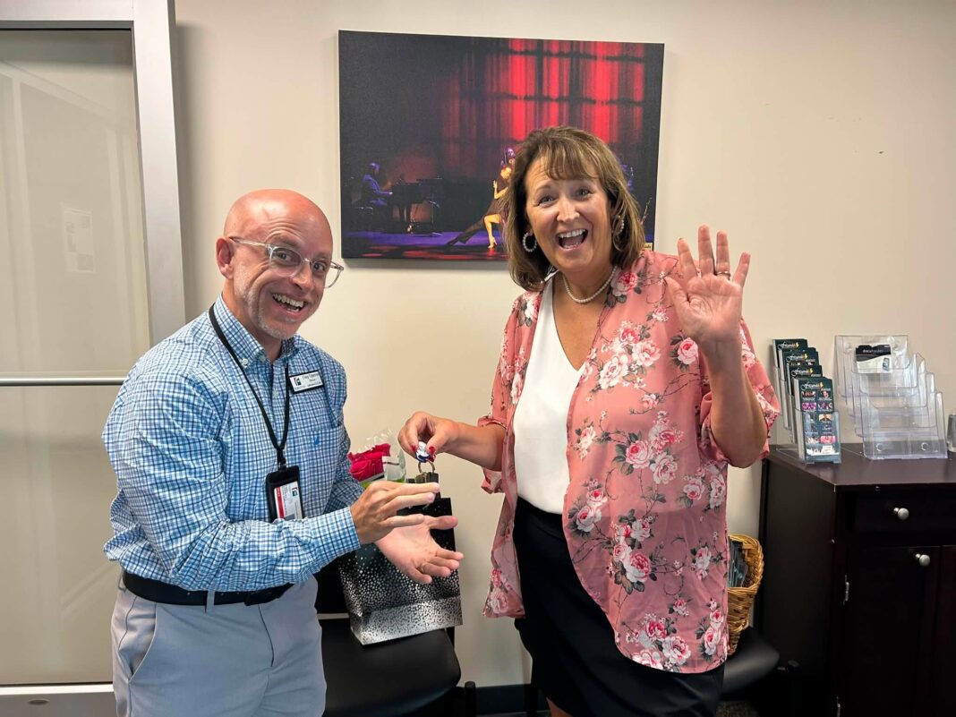 Craig Uppercue takes the keys as Amelia Fulmer says her goodbyes.